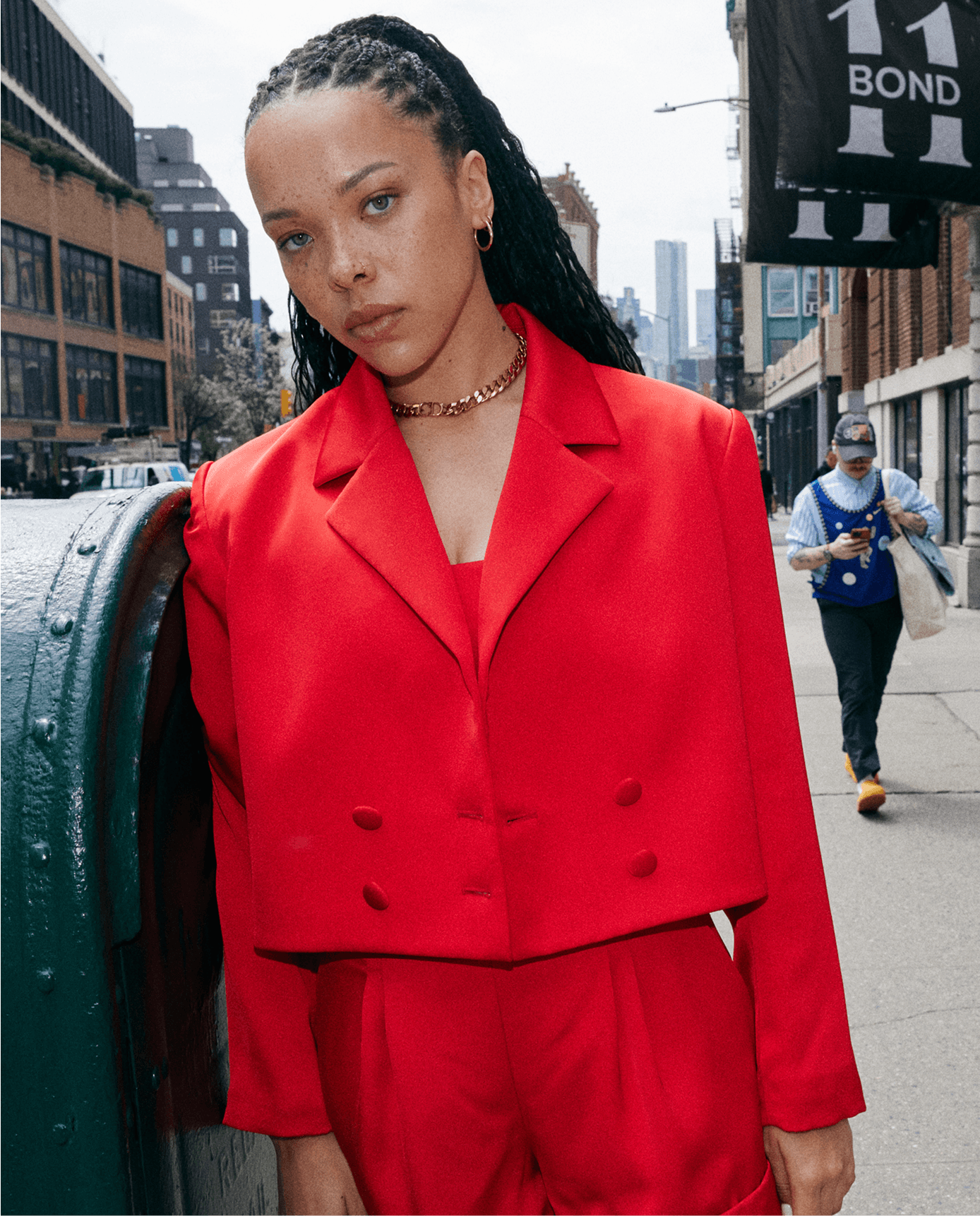 woman in cropped red blazer satin set