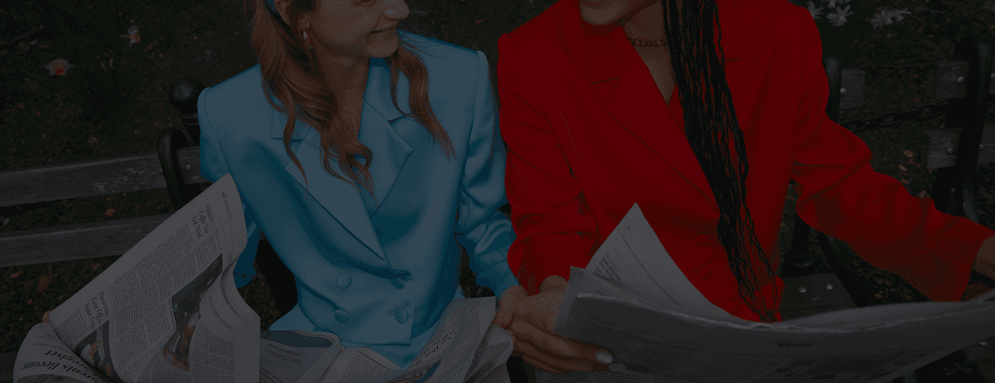 women sitting in matching suit sets